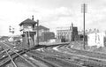 Vintage black and white photograph of a railway junction with signal boxes and tracks.